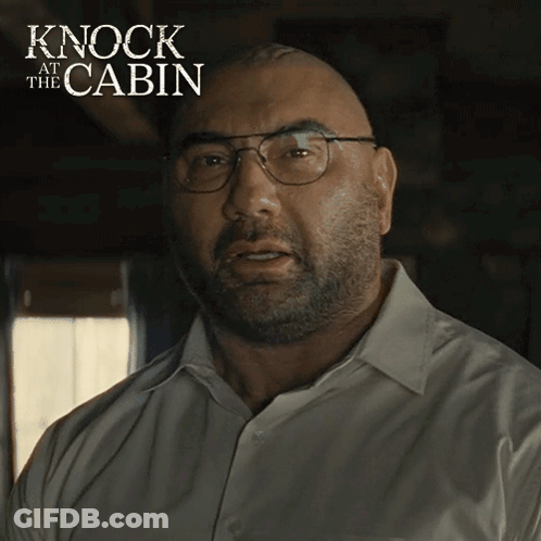 A Bald Man Wearing Glasses And A White Shirt With The Words Knock At The Cabin On The Bottom GIF
