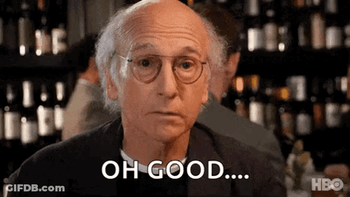 A Bald Man Wearing Glasses Is Sitting At A Table In Front Of A Bar And Saying `` Oh Good ... '' . GIF