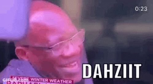 A Bald Man Wearing Glasses Is Smiling And Talking On A Radio Show . GIF