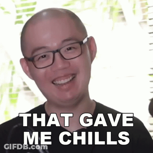 A Bald Man Wearing Glasses Is Smiling With The Words That Gave Me Chills Below Him GIF