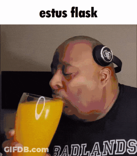 Bald Man With Headphones Drinking Orange Juice GIF