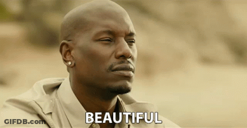 A Bald Man With A Beard And Earrings Says Beautiful GIF