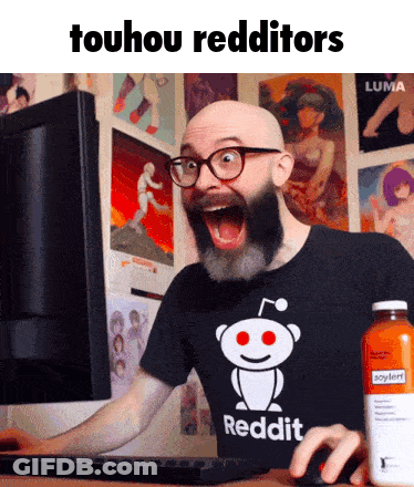 A Bald Man With A Beard And Glasses Is Using A Computer While Wearing A Reddit Shirt GIF