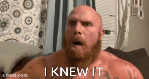 A Bald Man With A Beard Has The Words I Knew It Written On His Chest GIF