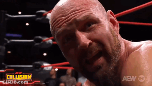 A Bald Man With A Beard Is In A Wrestling Ring With The Aew Collision Logo Behind Him GIF