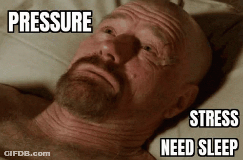 A Bald Man With A Beard Is Laying On A Bed With The Words Pressure Stress Need Sleep Above His Head . GIF