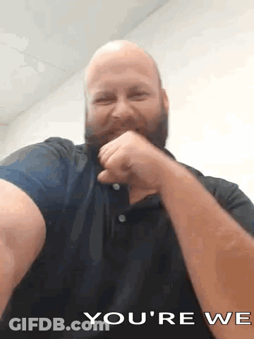 A Bald Man With A Beard Is Making A Funny Face And Says You 'Re We GIF