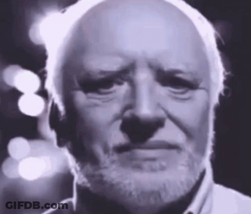 A Bald Man With A Beard Is Making A Sad Face . GIF