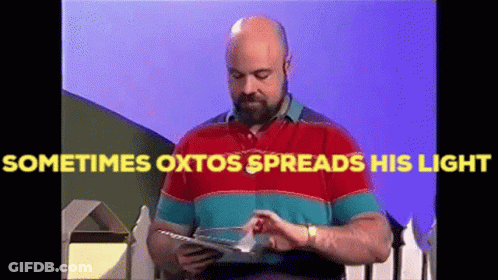 A Bald Man With A Beard Is Reading A Book With The Words Sometimes Oxtos Spreads His Light Above Him GIF