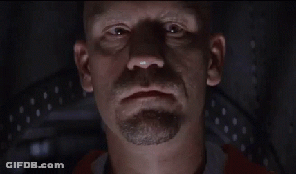 A Bald Man With A Beard Is Saying Welcome To Con Air GIF