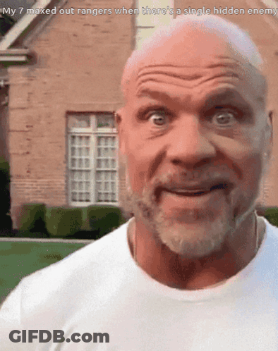 A Bald Man With A Beard Is Smiling In Front Of A Brick House GIF
