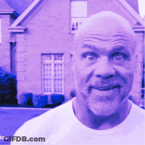 A Bald Man With A Beard Is Smiling In Front Of A House GIF