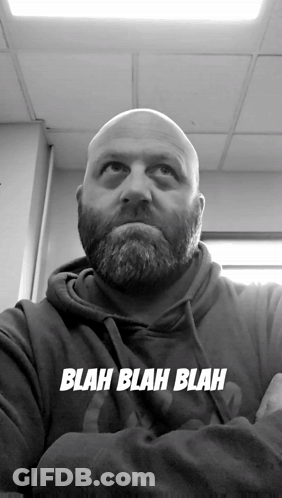 A Bald Man With A Beard Is Wearing A Blah Blah Blah Hoodie GIF