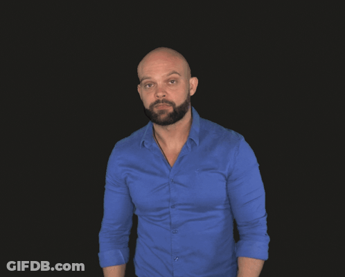 A Bald Man With A Beard Is Wearing A Blue Shirt And A Smart Watch GIF
