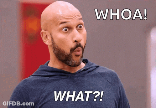 A Bald Man With A Beard Is Wearing A Blue Shirt That Says " What " GIF