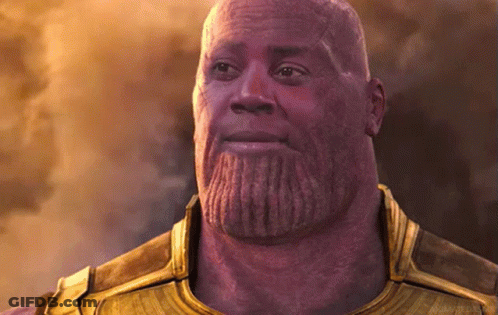 A Bald Man With A Beard Is Wearing A Gold Armor .. GIF