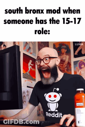 A Bald Man With A Beard Wearing A Reddit Shirt Looks At A Computer Screen GIF