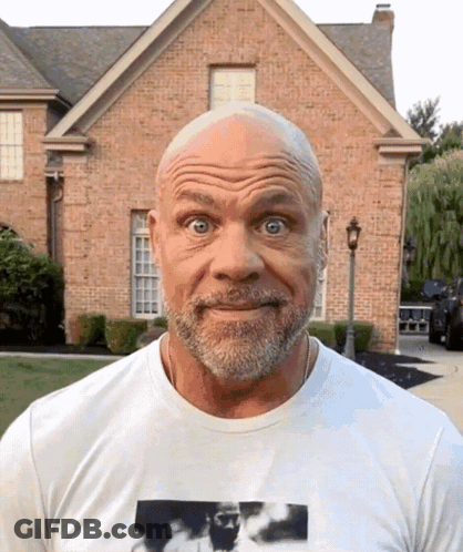 A Bald Man With A Beard Wearing A White Shirt GIF