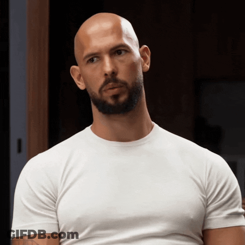 A Bald Man With A Beard Wearing A White T-Shirt GIF