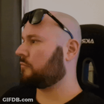 A Bald Man With A Beard Wearing Sunglasses And A Black Shirt With The Word Jka On It GIF
