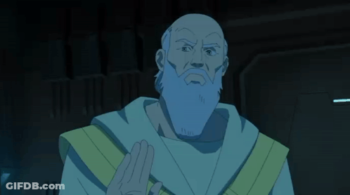 A Bald Man With A Long Beard And A Yellow Robe Holds Something In His Hand GIF
