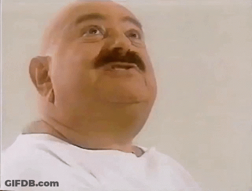 A Bald Man With A Mustache Is Eating A Sandwich From Subway GIF
