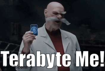 A Bald Man With A Mustache Is Holding A Card And Says Terabyte Me GIF