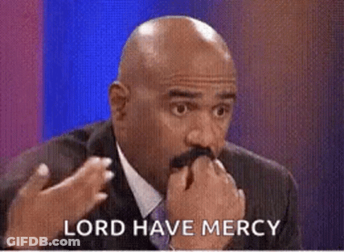 A Bald Man With A Mustache Is Sitting In Front Of A Blue Background And Says `` Lord Have Mercy '' . GIF
