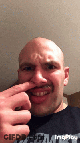 A Bald Man With A Mustache Is Wearing A Shirt That Says Imgplay On It GIF