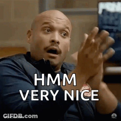 A Bald Man With A Surprised Look On His Face Is Clapping His Hands And Saying Hmm Very Nice GIF