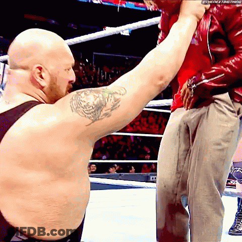 A Bald Man With A Tattoo On His Arm Holds Another Man 'S Arm GIF