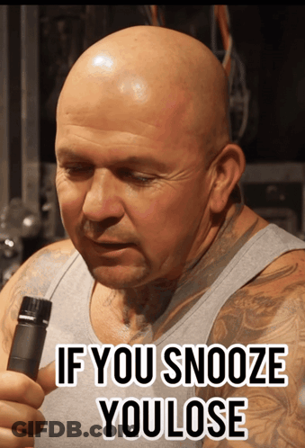 A Bald Man With A Tattoo On His Arm Is Holding A Bottle And Says If You Snooze You Lose GIF