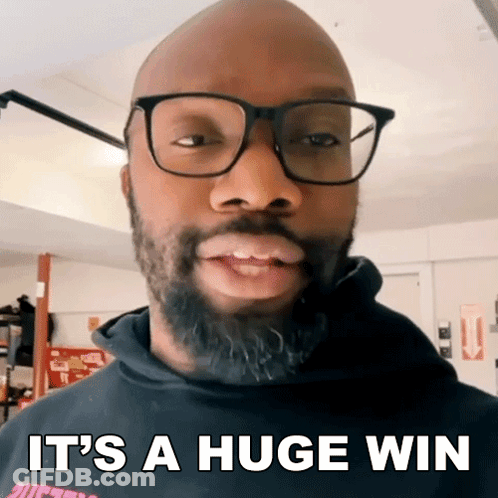 A Bald Man With Glasses And A Beard Is Saying It 'S A Huge Win GIF