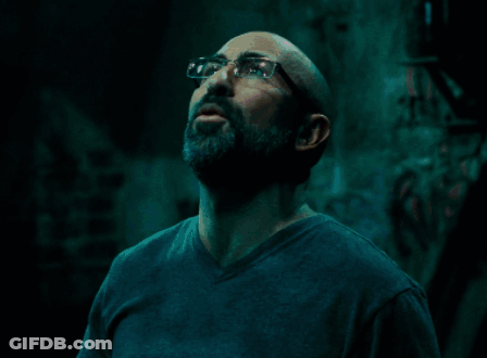 Bald Man With Glasses And Beard Looking Up GIF