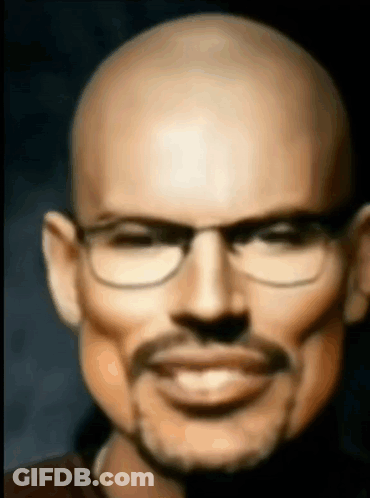 A Bald Man With Glasses And A Mustache Is Smiling And Looking At The Camera . GIF