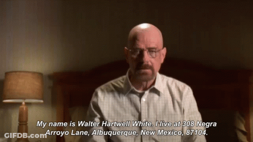 A Bald Man With Glasses And A Mustache Says " My Name Is Walter Hartwell White " In Front Of A Bed GIF