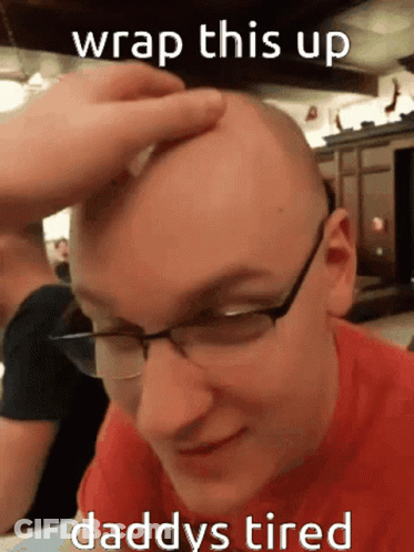 A Bald Man With Glasses Is Being Touched By Someone With The Caption " Wrap This Up Daddy 'S Tired " GIF
