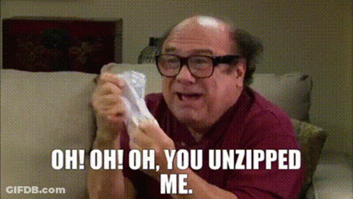 A Bald Man With Glasses Is Sitting On A Couch Holding A Piece Of Paper And Saying Oh Oh Oh You Unzipped Me GIF