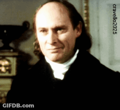 A Bald Man With Long Hair Looks At The Camera With The Year 2025 On The Bottom GIF