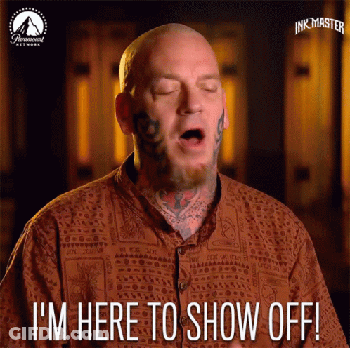 A Bald Man With Tattoos On His Face Says I 'M Here To Show Off GIF