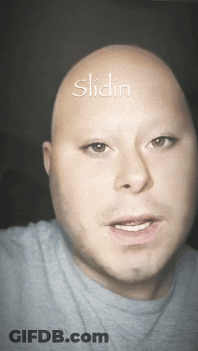A Bald Man With The Word Slidin Written On His Head GIF