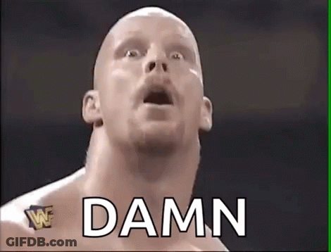 A Bald Wrestler With His Mouth Open And The Word Damn Written Above Him . GIF