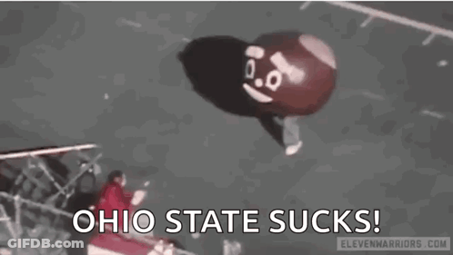 A Balloon With A Face On It Is Flying In The Air And Says `` Ohio State Sucks '' . GIF