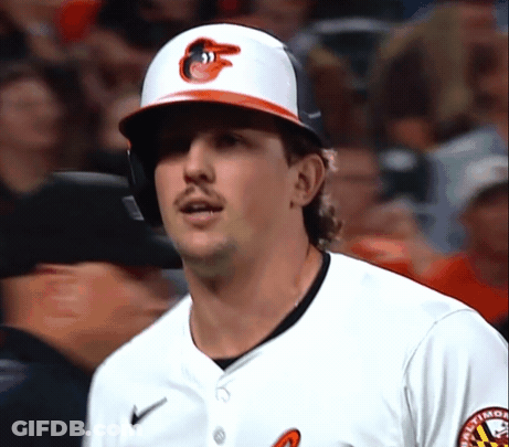 A Baltimore Orioles Baseball Player Wearing A Helmet And A White Jersey GIF