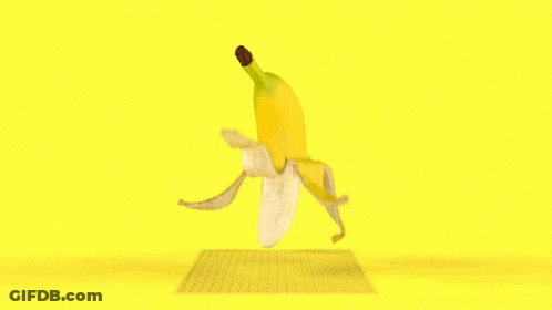 A Banana That Has Been Peeled On A Yellow Surface GIF