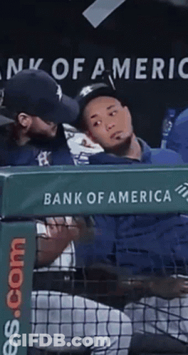 A Bank Of America Sign Is Behind A Baseball Dugout GIF