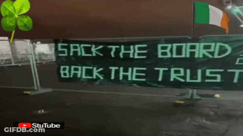 A Banner That Says " Back The Bird " Is Hanging On A Window GIF