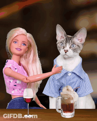 A Barbie Doll And A Cat Are Sitting At A Table With A Glass Of Wine And A Mug Of Beer GIF