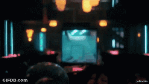 A Bartender Is Pouring A Drink Into A Glass With The Word Polinerin On The Bottom Right GIF