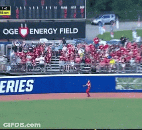 A Baseball Field With A Large Oge Energy Field Sign GIF